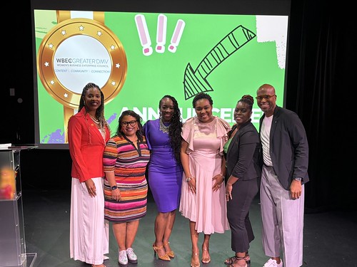 Washington, D.C., Pitch Competition Finalists, WBEC NY DMV President & CEO Phala Mire, and Host Jonathan Sprinkles standing in front of a green screen