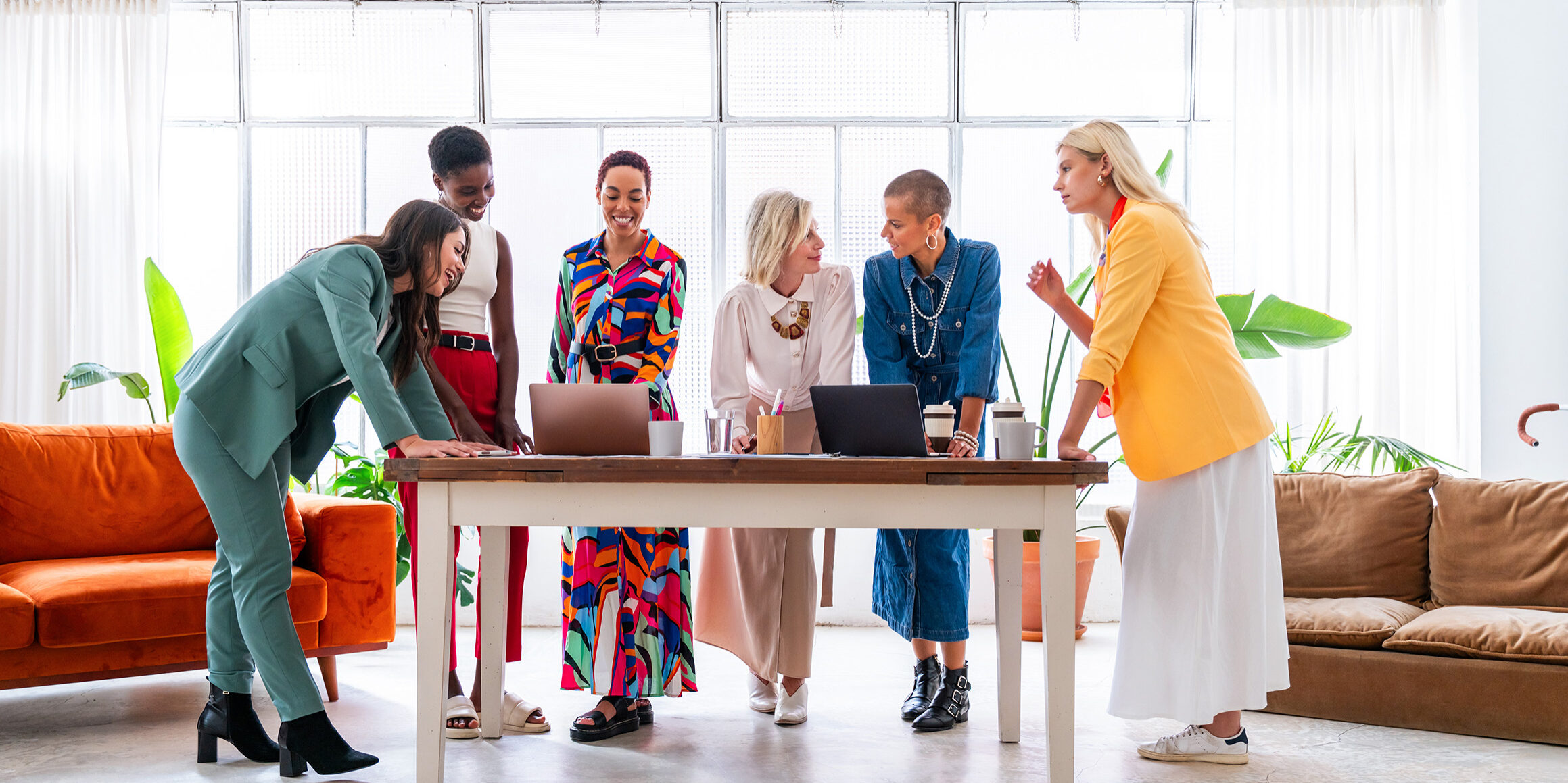 Group of businesswomen meeting in the office brainstorming at work